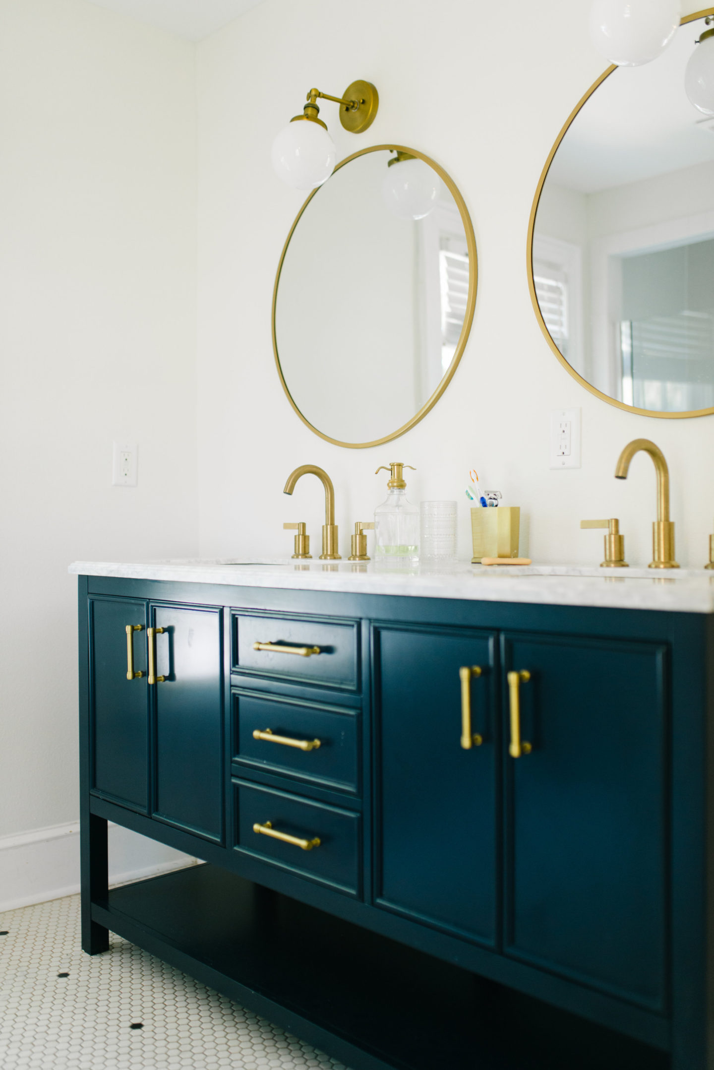Navy and Brass Bathroom update with beauty items I'm loving
