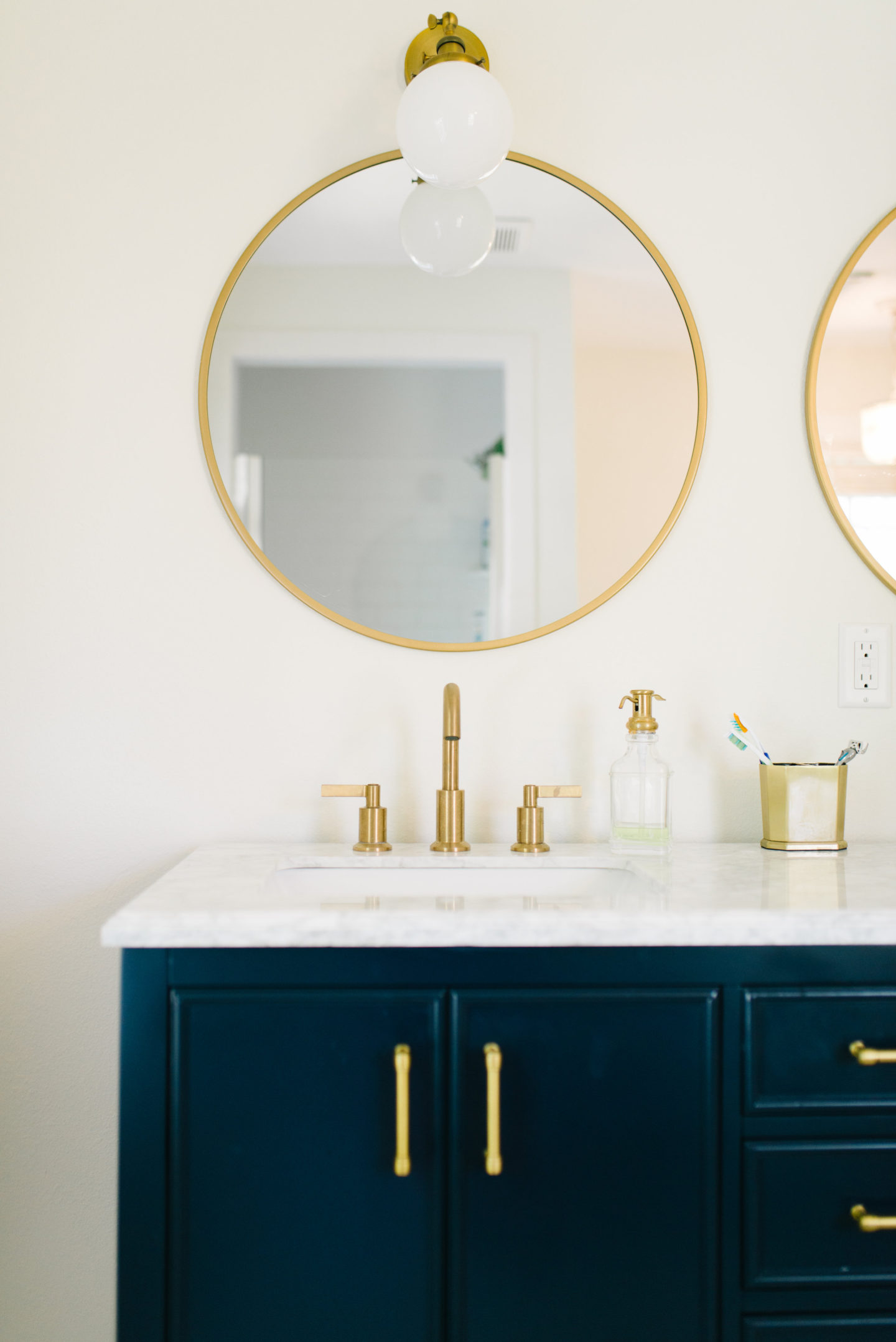 Navy and Brass Bathroom update with beauty items I'm loving