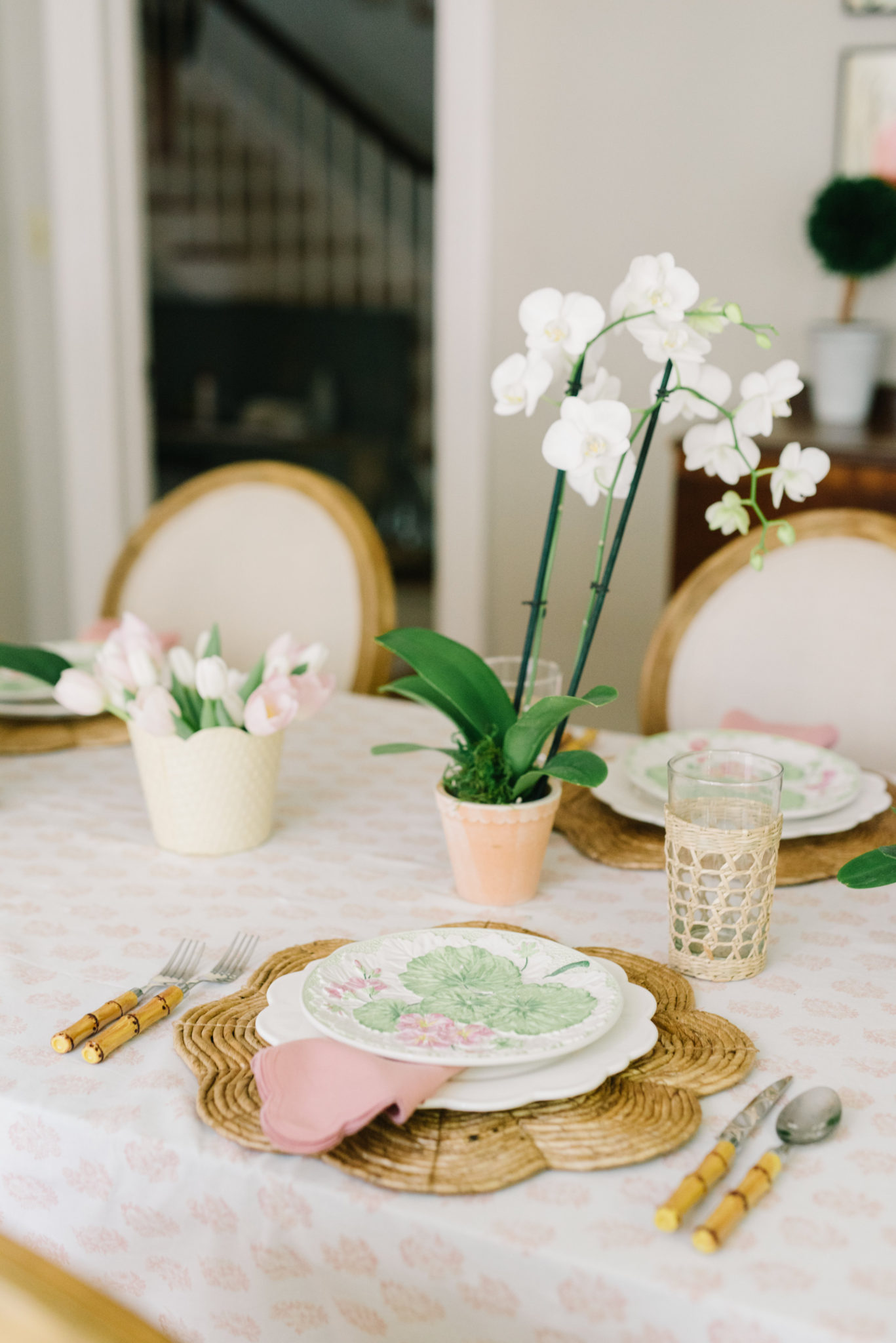 Pink and green feminine tablescape orchid tulips publix